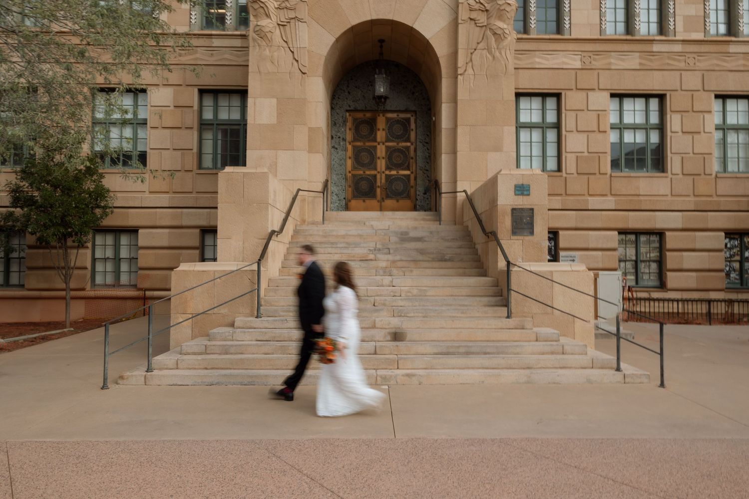 A sequence of photos showing two people in formal attire walking down stone steps at a historic building entrance.