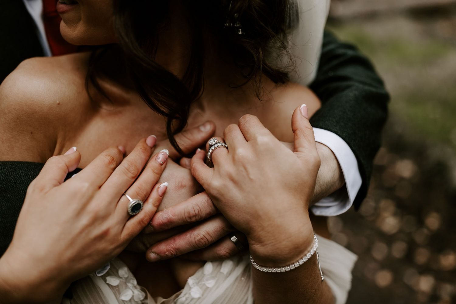 Close up shot of newlyweds sharing a romantic kiss during their outdoor wedding ceremony.