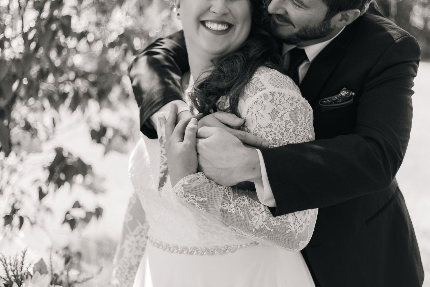 A black and white photo collage showing tender embraces and romantic moments between a couple on their wedding day.