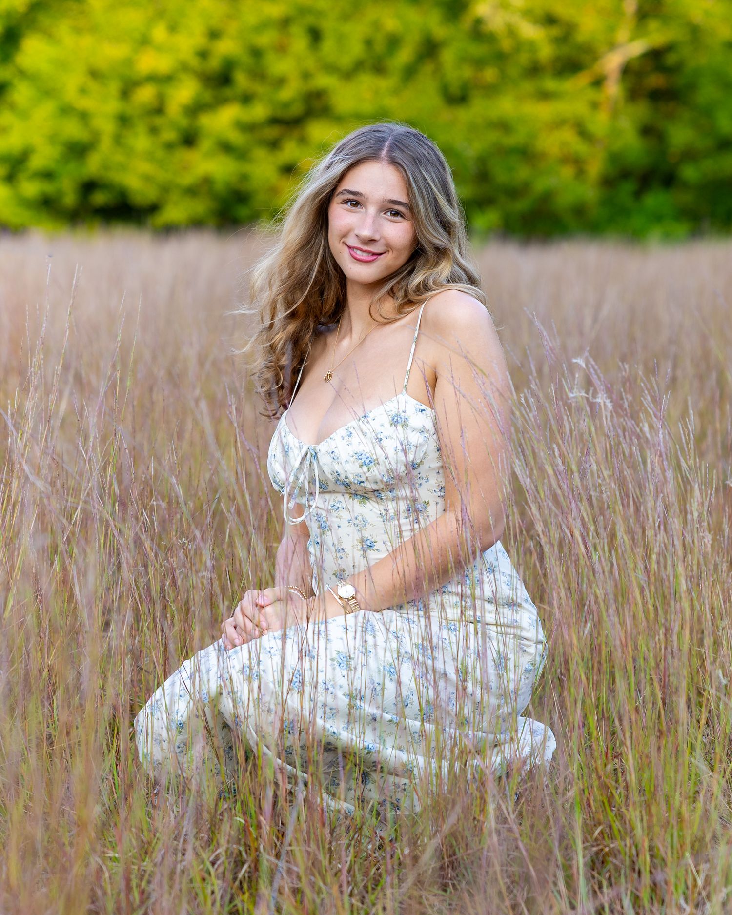 A Lincoln Sudbury Senior poses in a grassy field in Sudbury, MA for yearbook portrait session. High School senior photographer. Weston.
