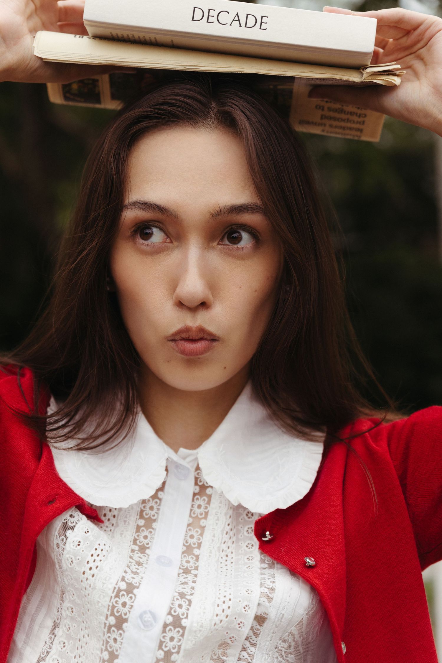 Eurasian editorial model holds book on head, Historic Downtown Atlanta photography