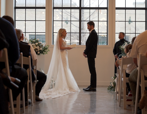 Couple reading vows at The Ridge in Logan, UT. Wedding video and photography by a Cache Valley wedding videographer at this scenic venue.