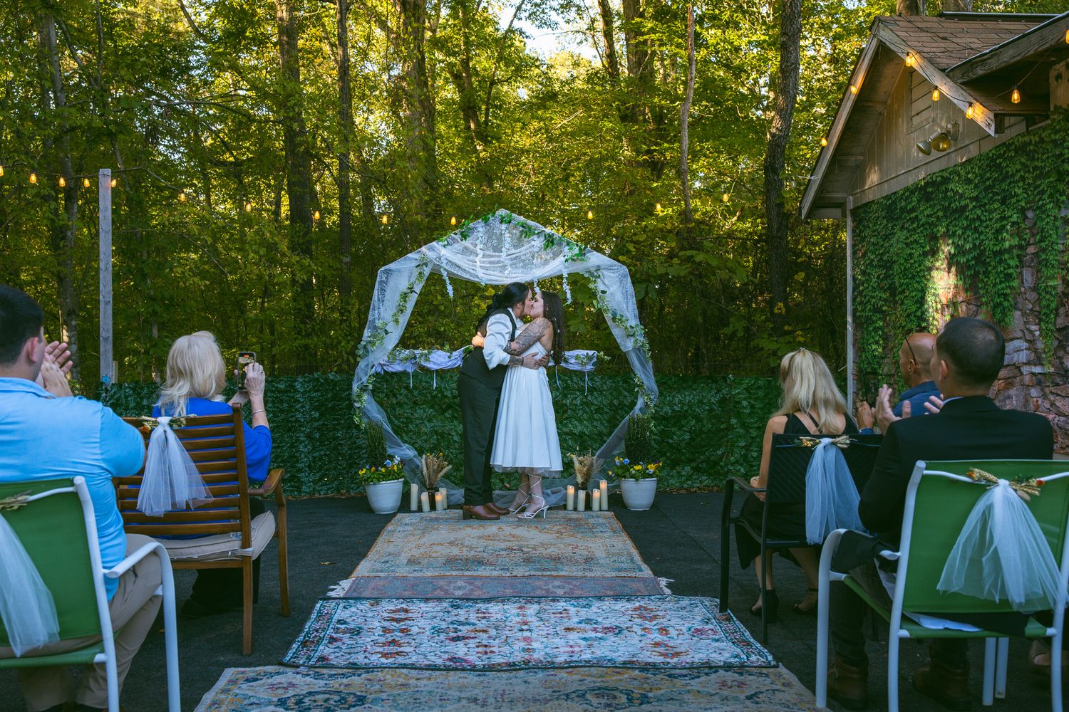 LGBTQ Couple kissing during elopement ceremony in blue ridge mountains Asheville, NC