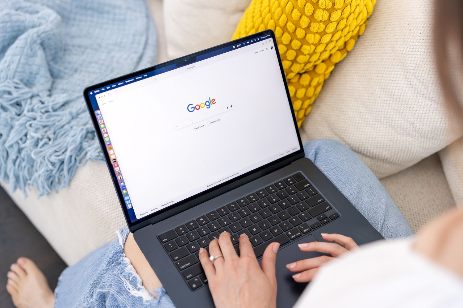 woman on laptop sitting on couch google seo searching business for branding lifestyle in Seattle, WA Jessica Stegner SEO Consultant