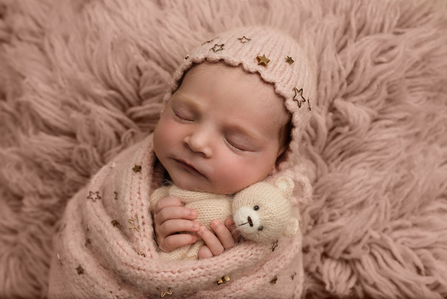 Charlottesville photographer, newborn, baby, maternity, family, newborn baby girl sleeping on pink flokati, holding plushy in pink wrap