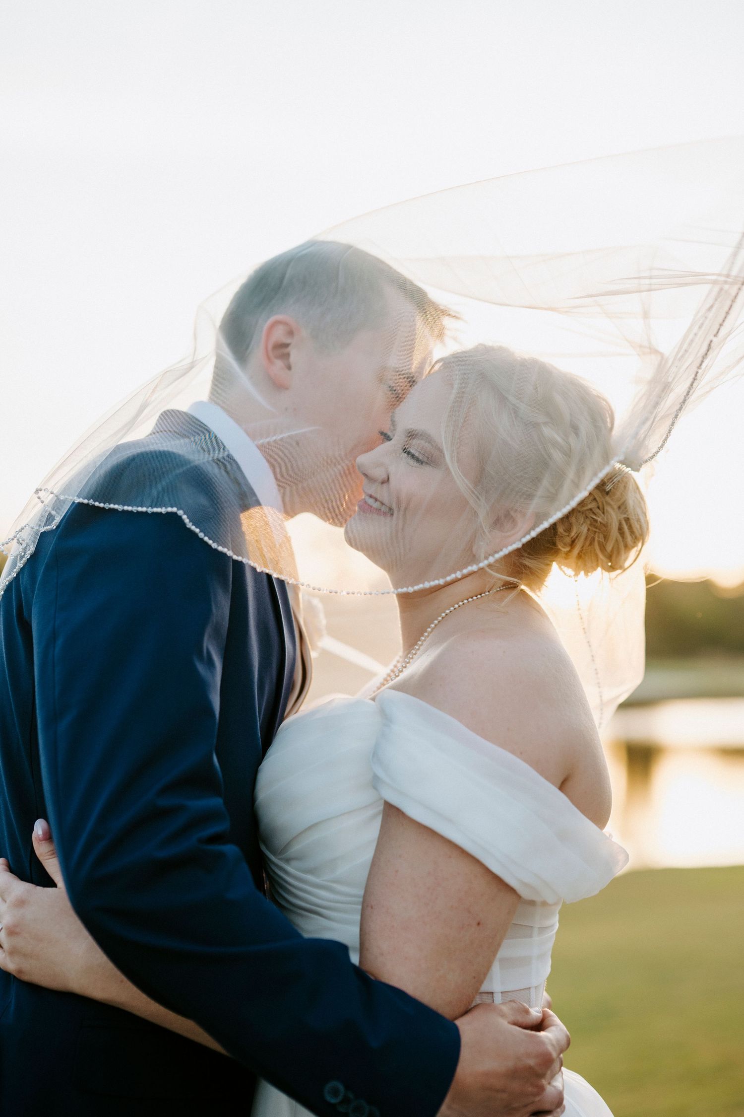 A romantic wedding couple embraces during golden hour sunset in a series of intimate portrait shots.