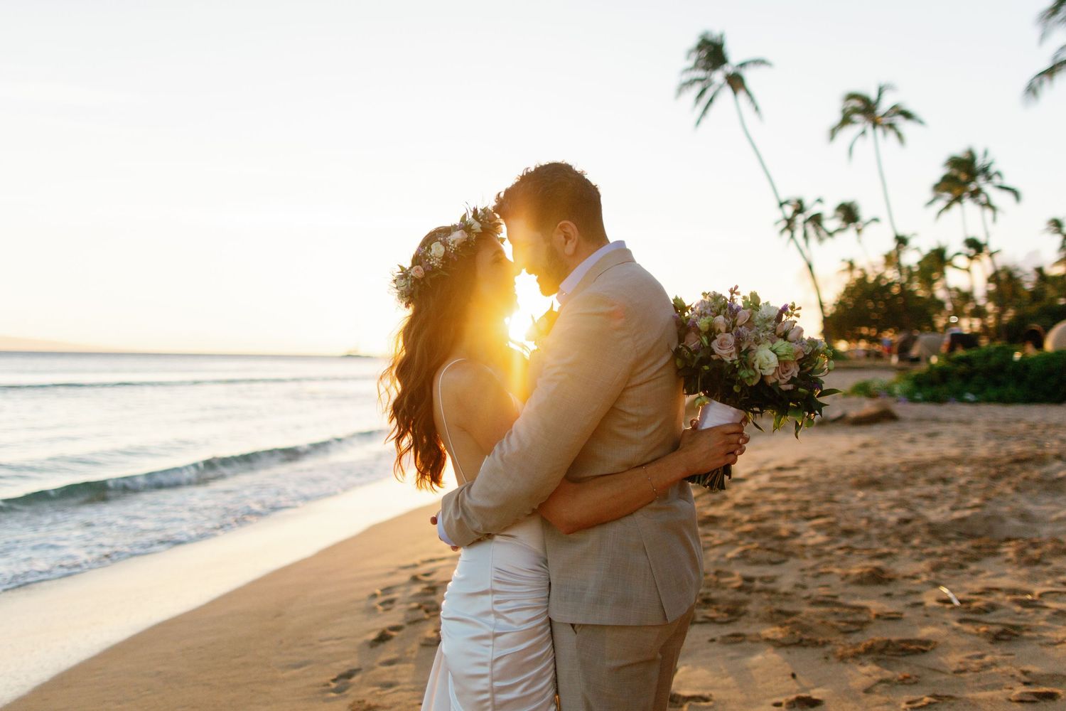 A set of 5 wedding photos at sunset showing silhouettes of the couple against palm trees and ocean views.