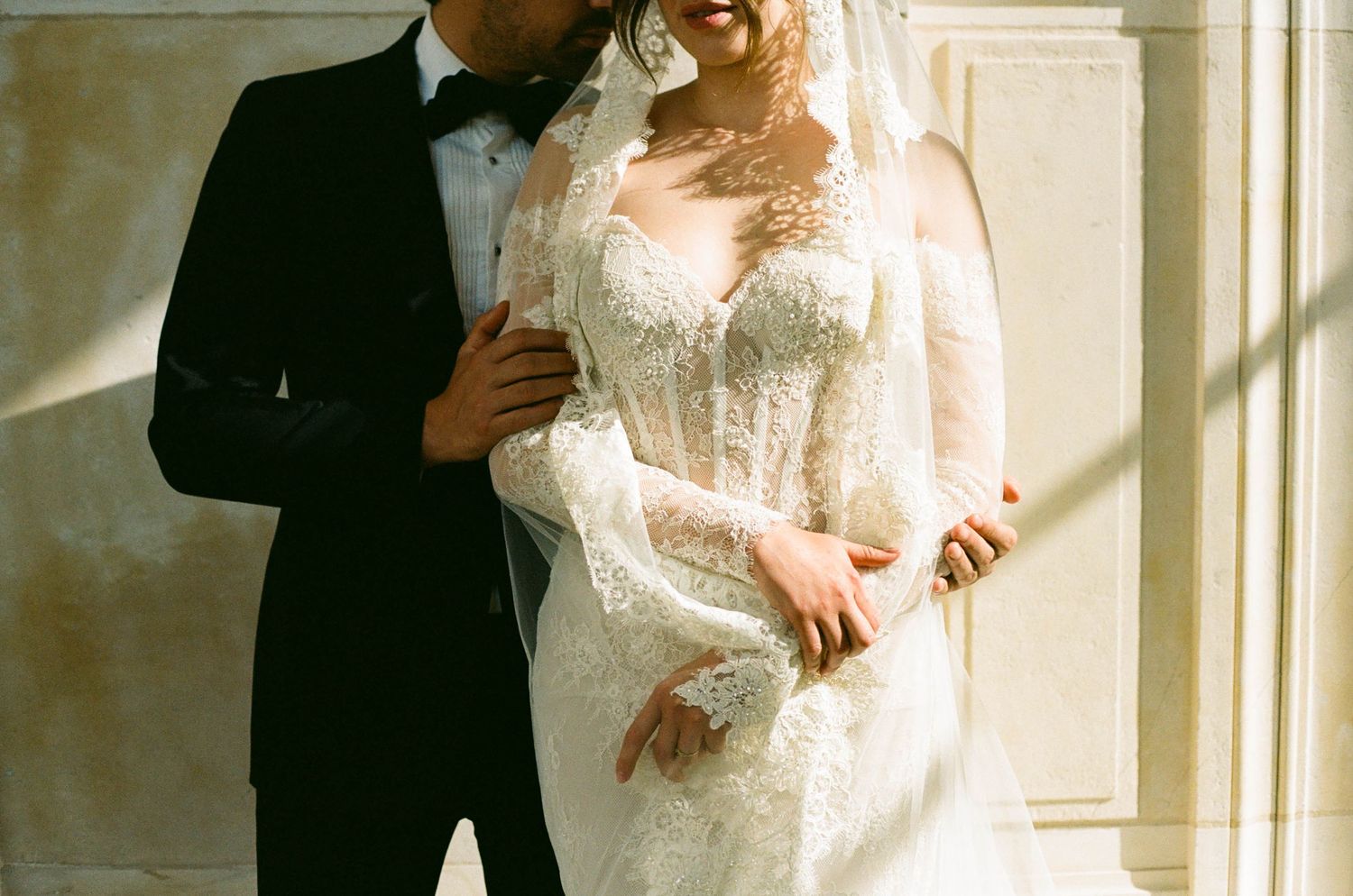 A row of wedding photographs showing a couple in formal attire posed together by sunlit windows.