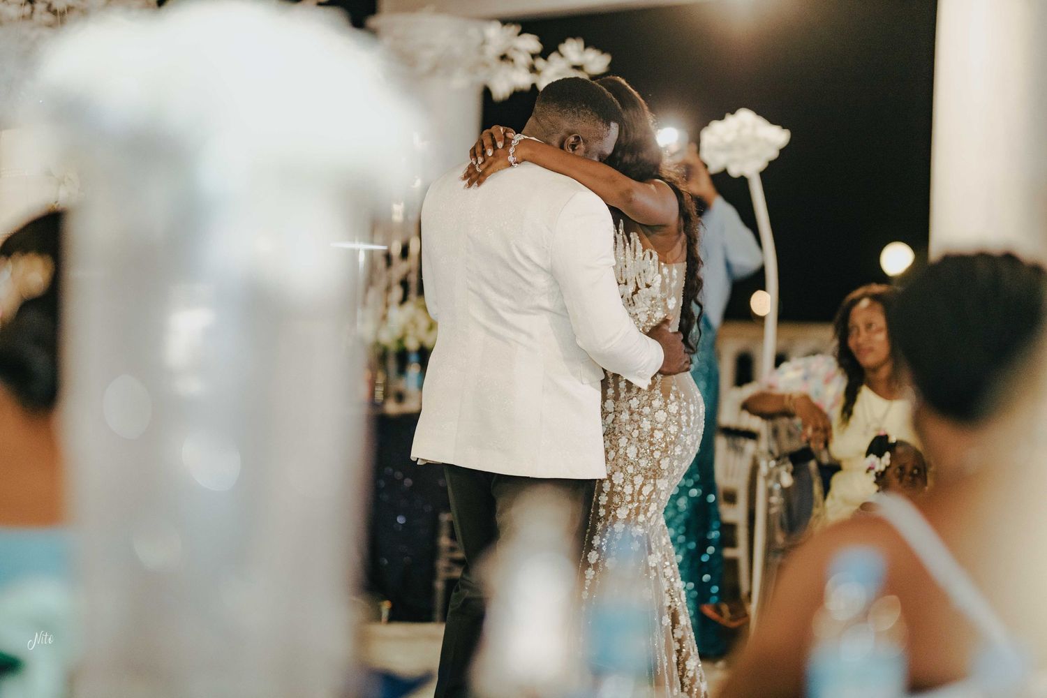Wedding reception celebration with guests and decor in elegant party setting.