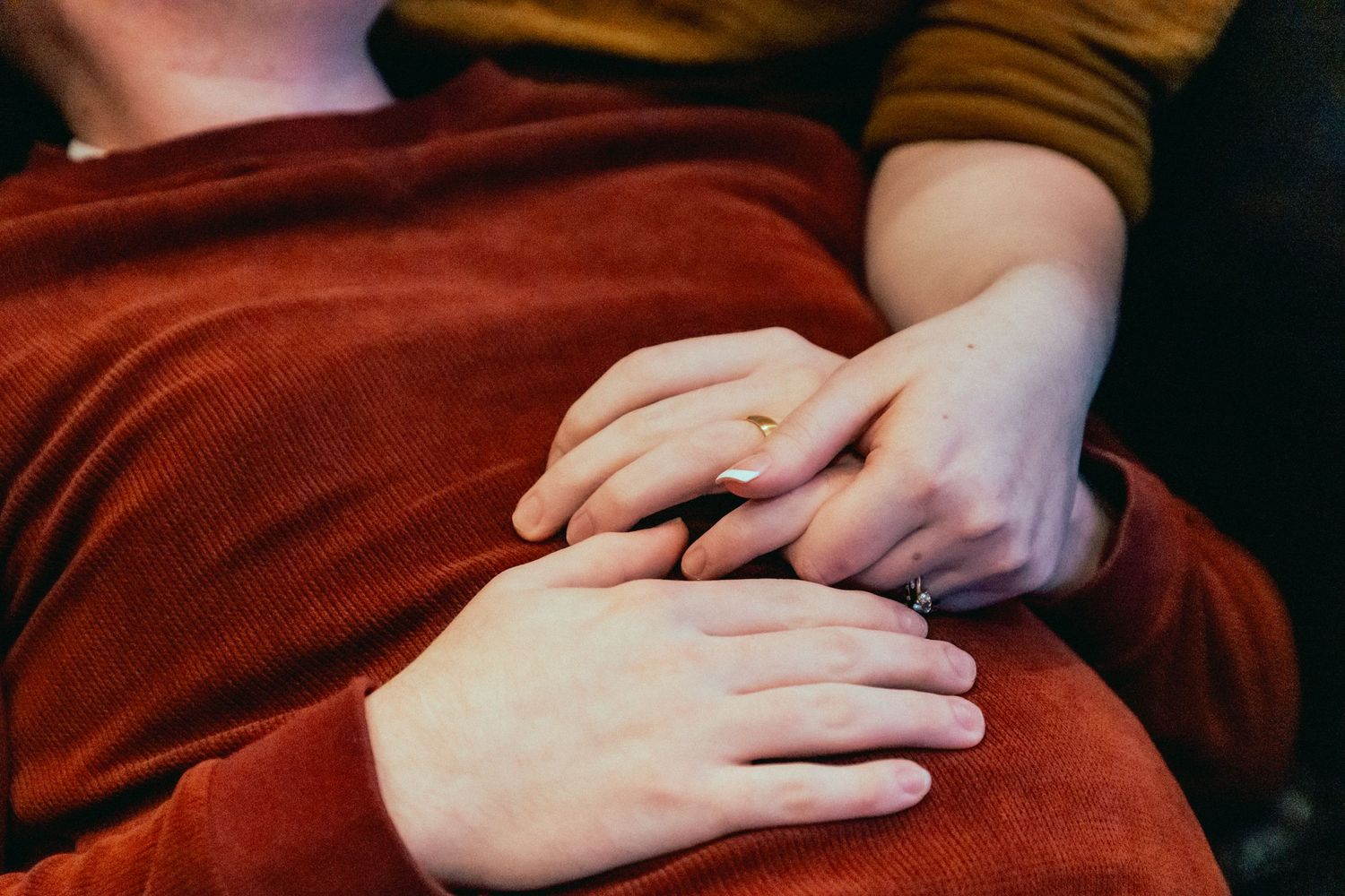 Married Couple holding hands while relaxing at romantic valentines day mini session in Bowling Green, Kentucky