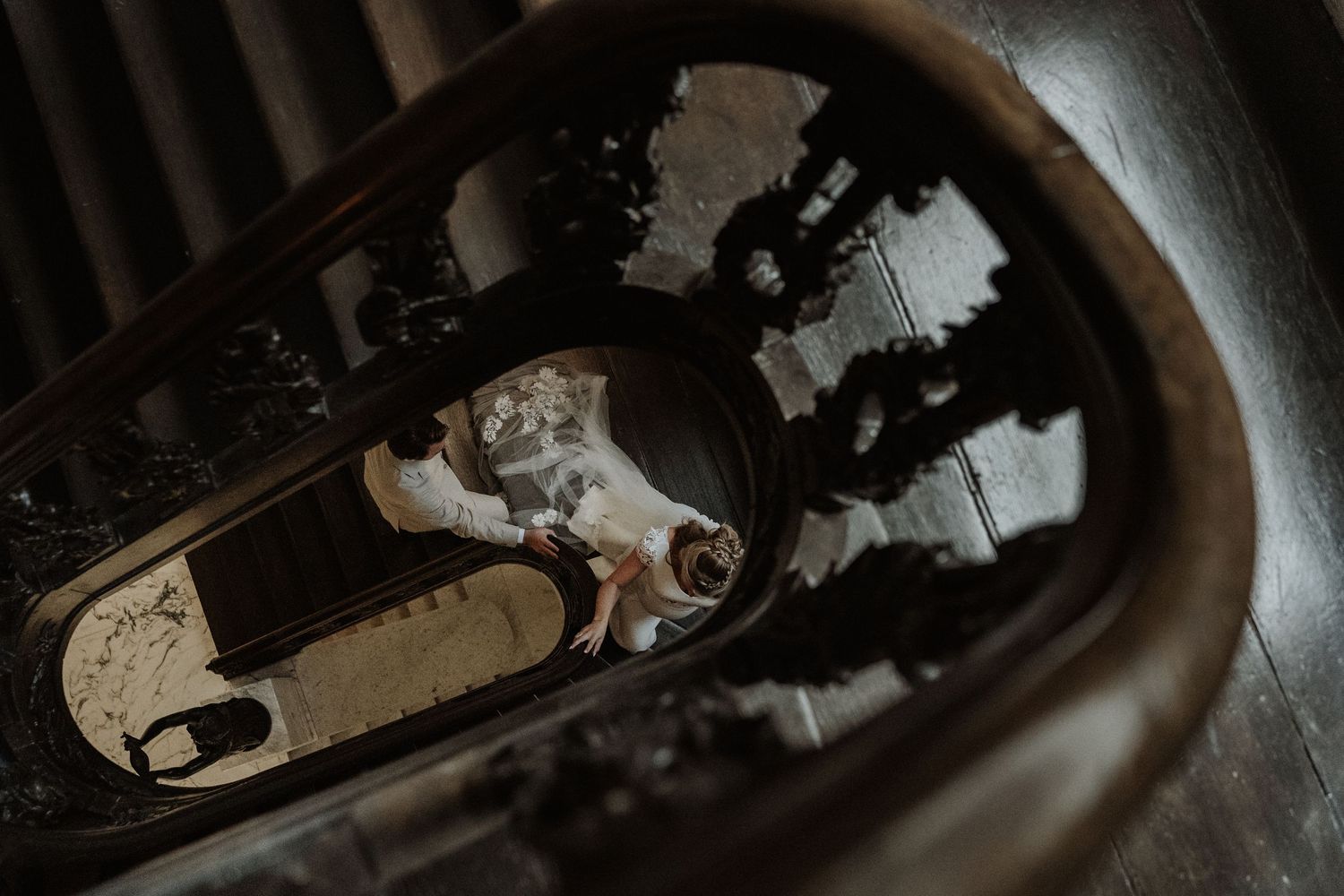 A close-up view of a rusty car fuel pump mechanism seen through a dark circular opening.