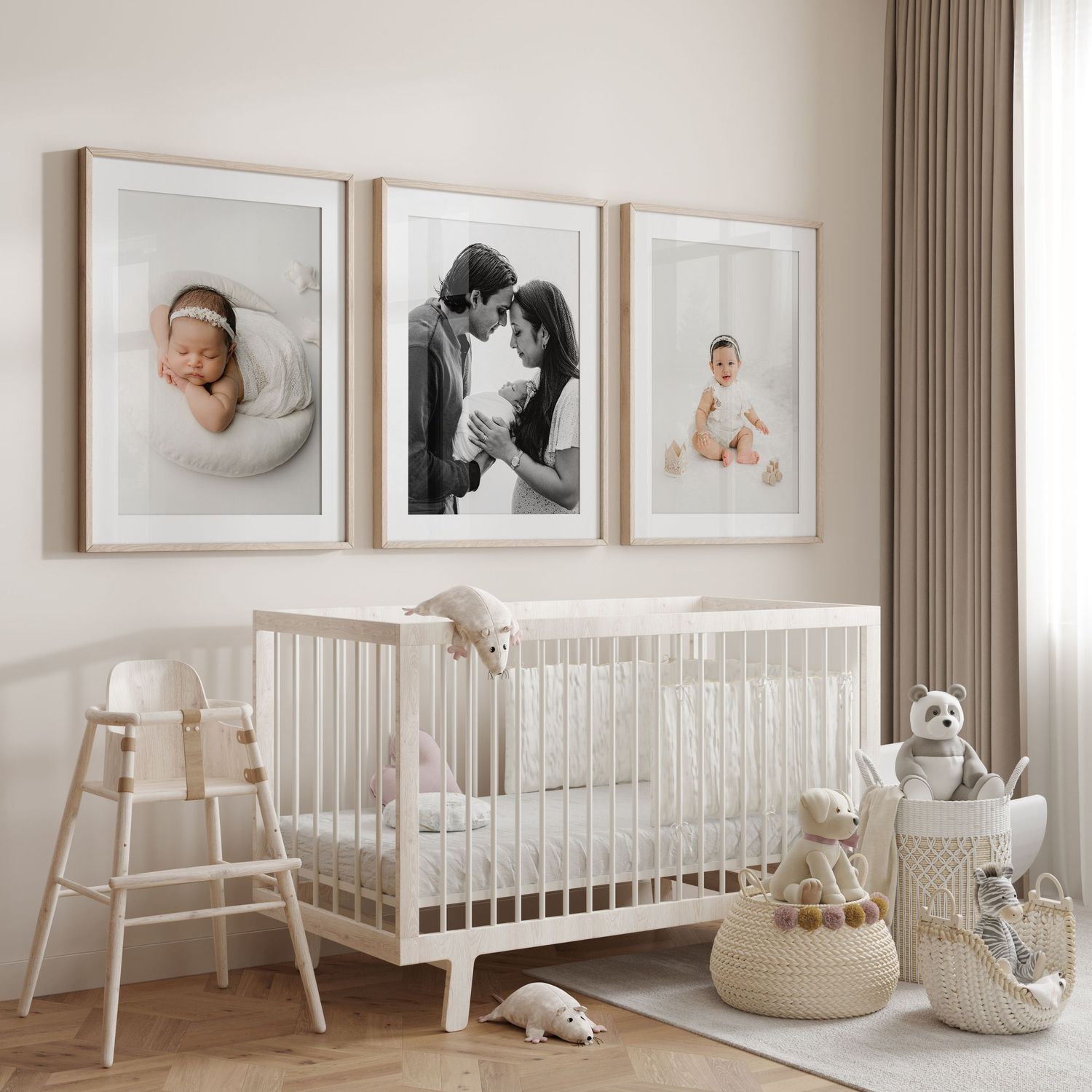 Minimalist nursery room with three framed photographs above white crib, wooden high chair and natural decor elements.