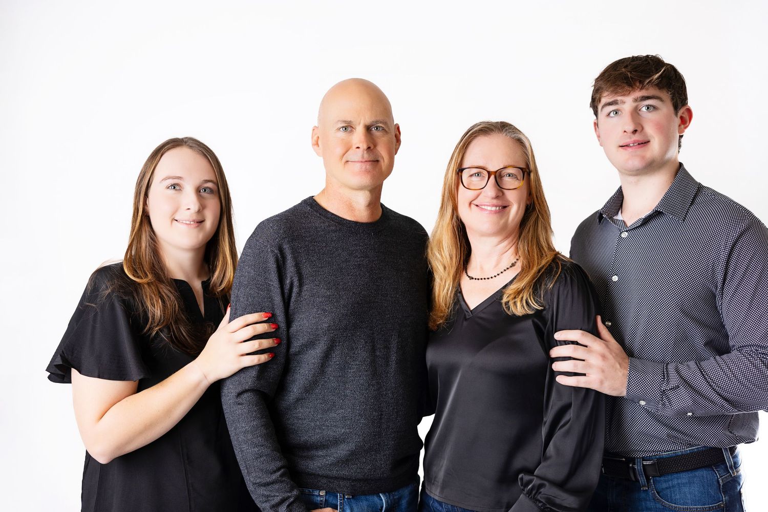 A group photo series showing multiple people wearing black and gray clothing against a white background.