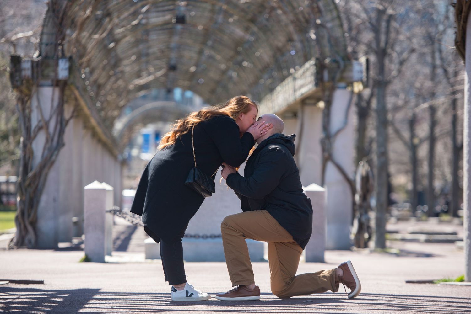 Marriage proposal under the trellis at Christopher Columbus Park in Boston’s Historic North End with Leah Ramuglia Photography.