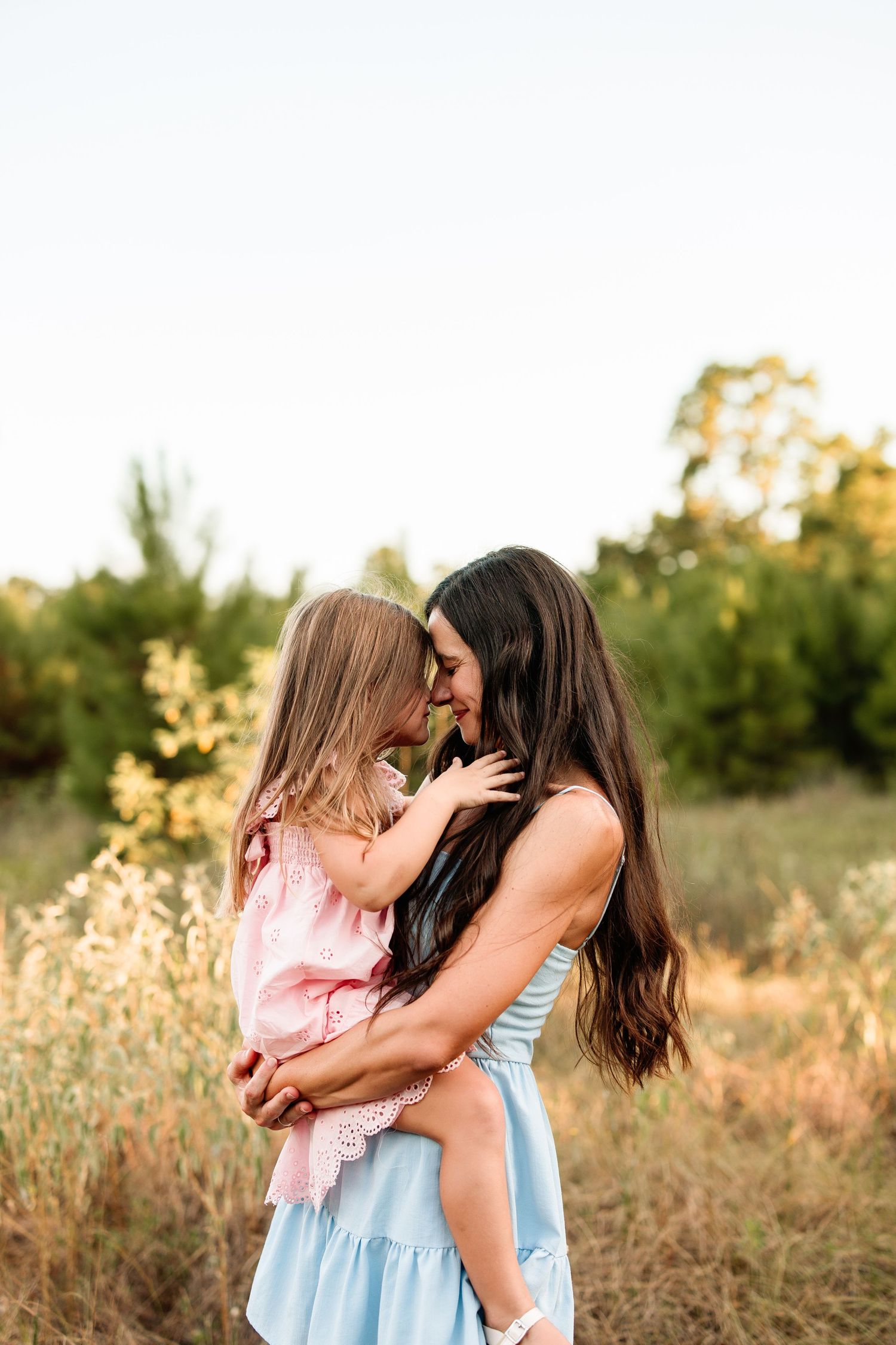 Lifestyle newborn session with family of four in a neutral, light-filled photography studio in Magnolia, Texas by Anna Carreno Photography