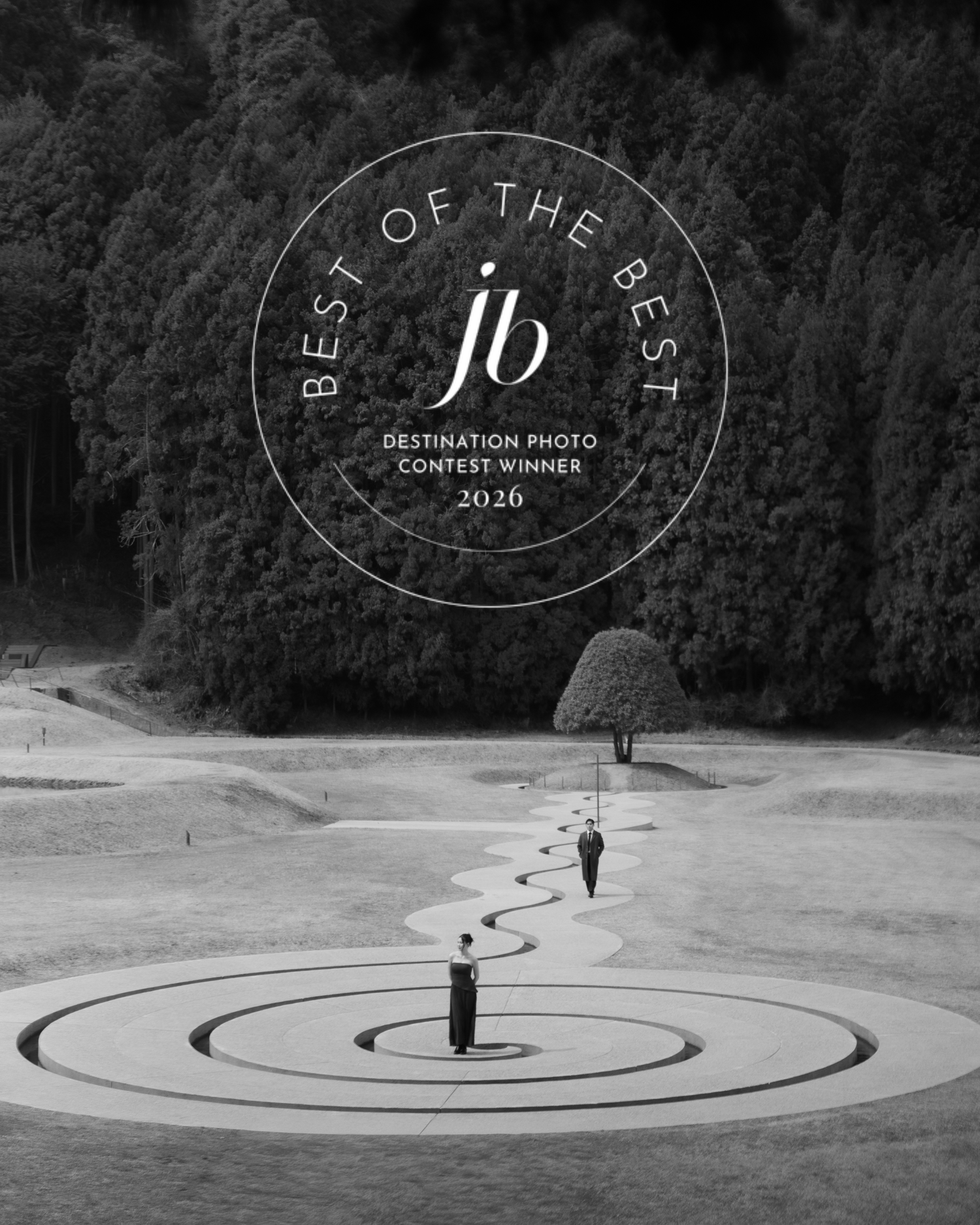 Black and white aerial photo of two people on a spiral garden path, winner of JB Destination Photo Contest 2026.