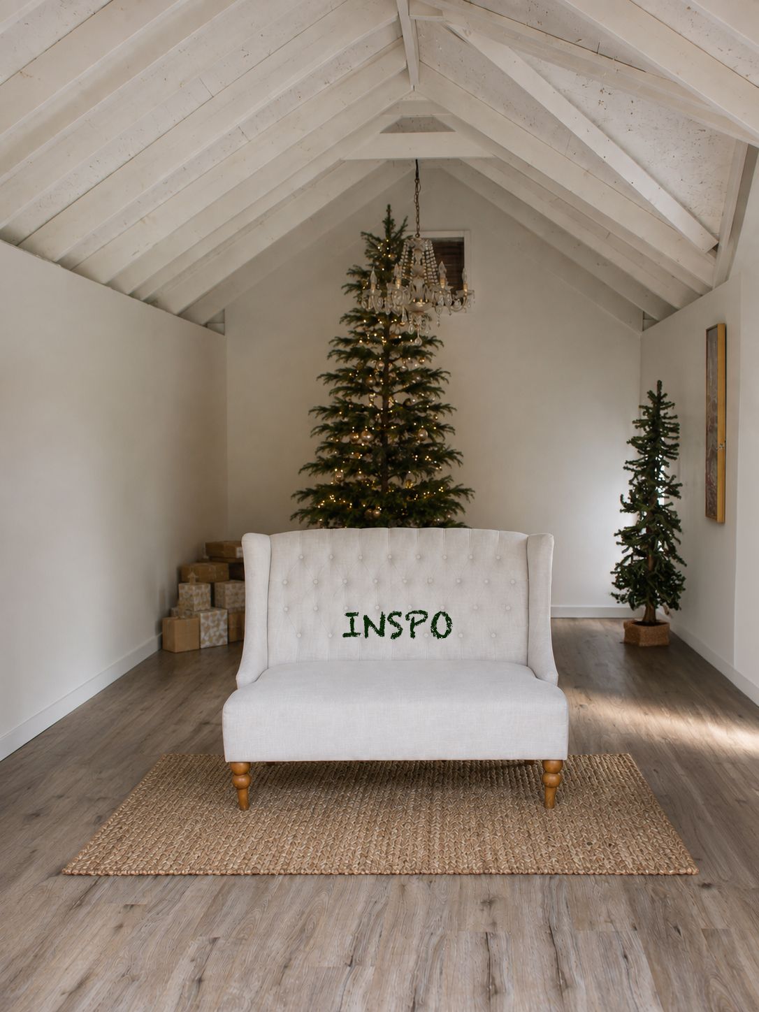 White tufted loveseat on jute rug in bright vaulted room with tall lit Christmas tree and wrapped gifts.