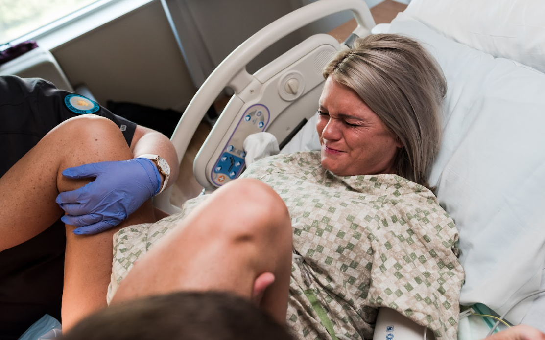 Medical professional administers an injection into a patient's arm during a healthcare procedure.