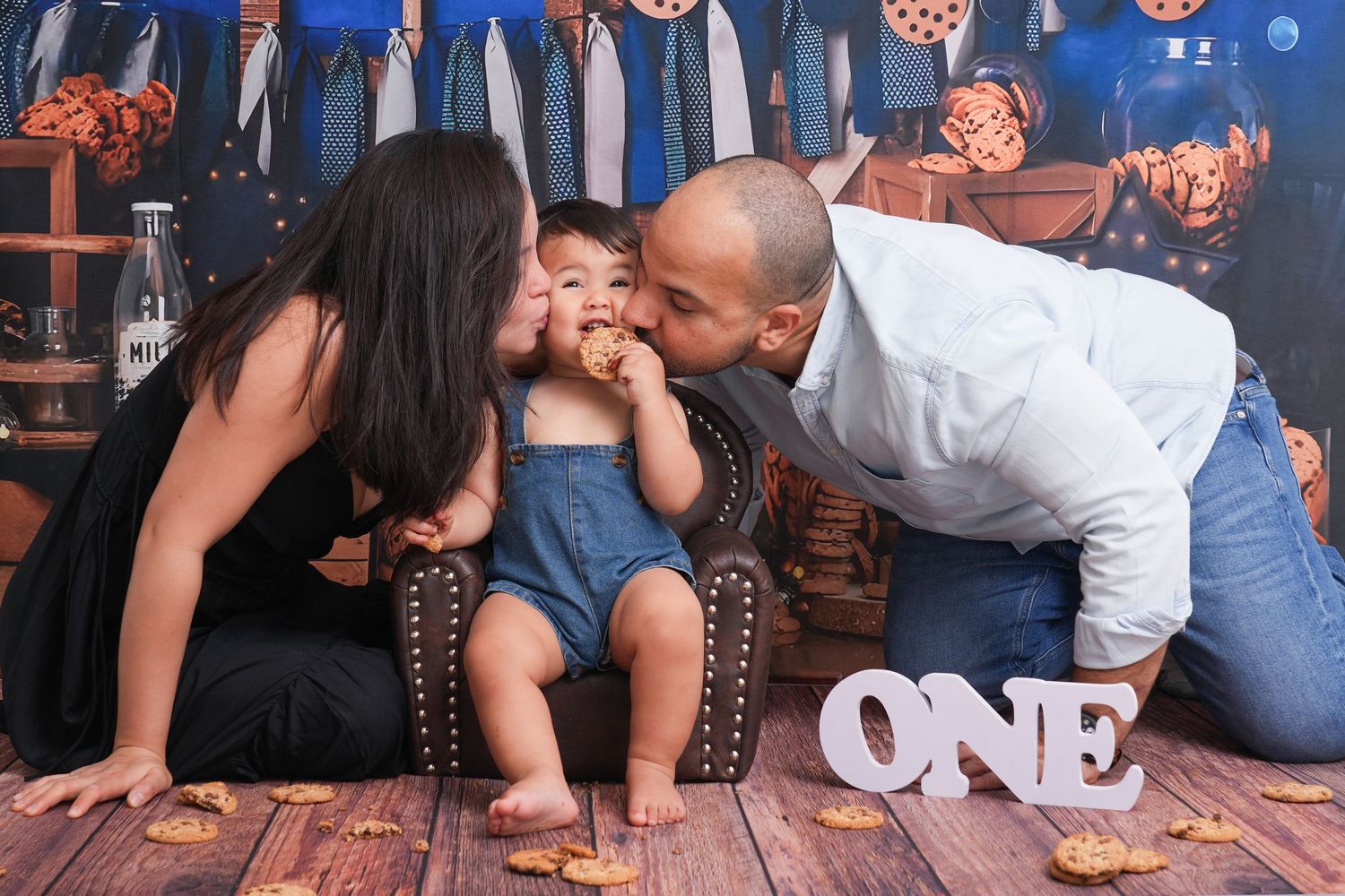 A baby enjoying their first birthday cake smash at a professional cake smash photography Dubai studio, capturing joyful and messy moments.