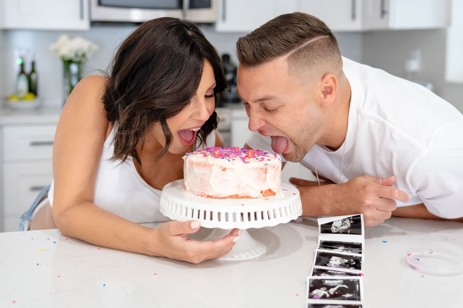 Sequence of photos showing a couple in bright white kitchen sharing loving embrace while cooking together.