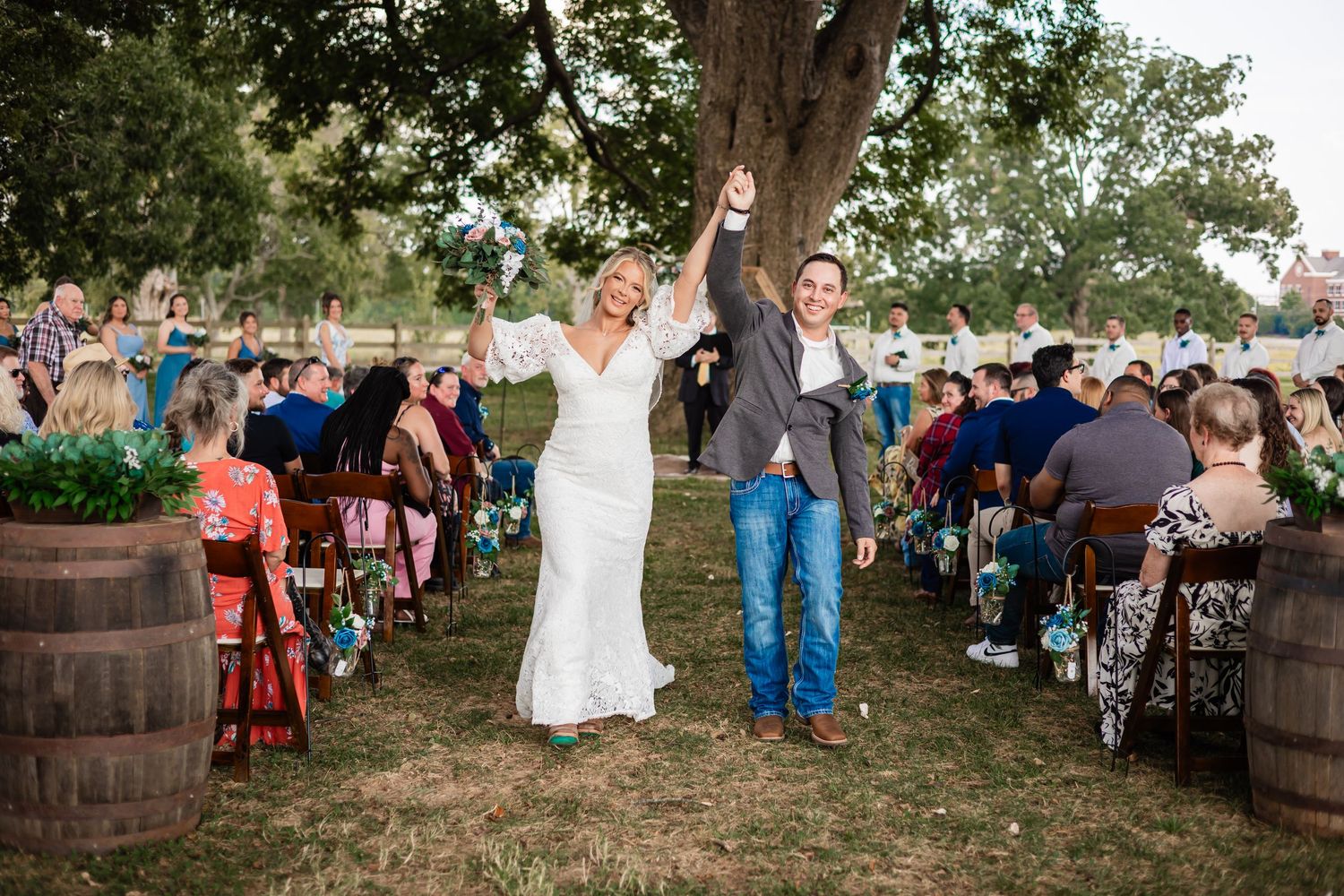 Mackenzie and Dan walking back down the aisle together after their wedding ceremony at Williamson Family Farm
