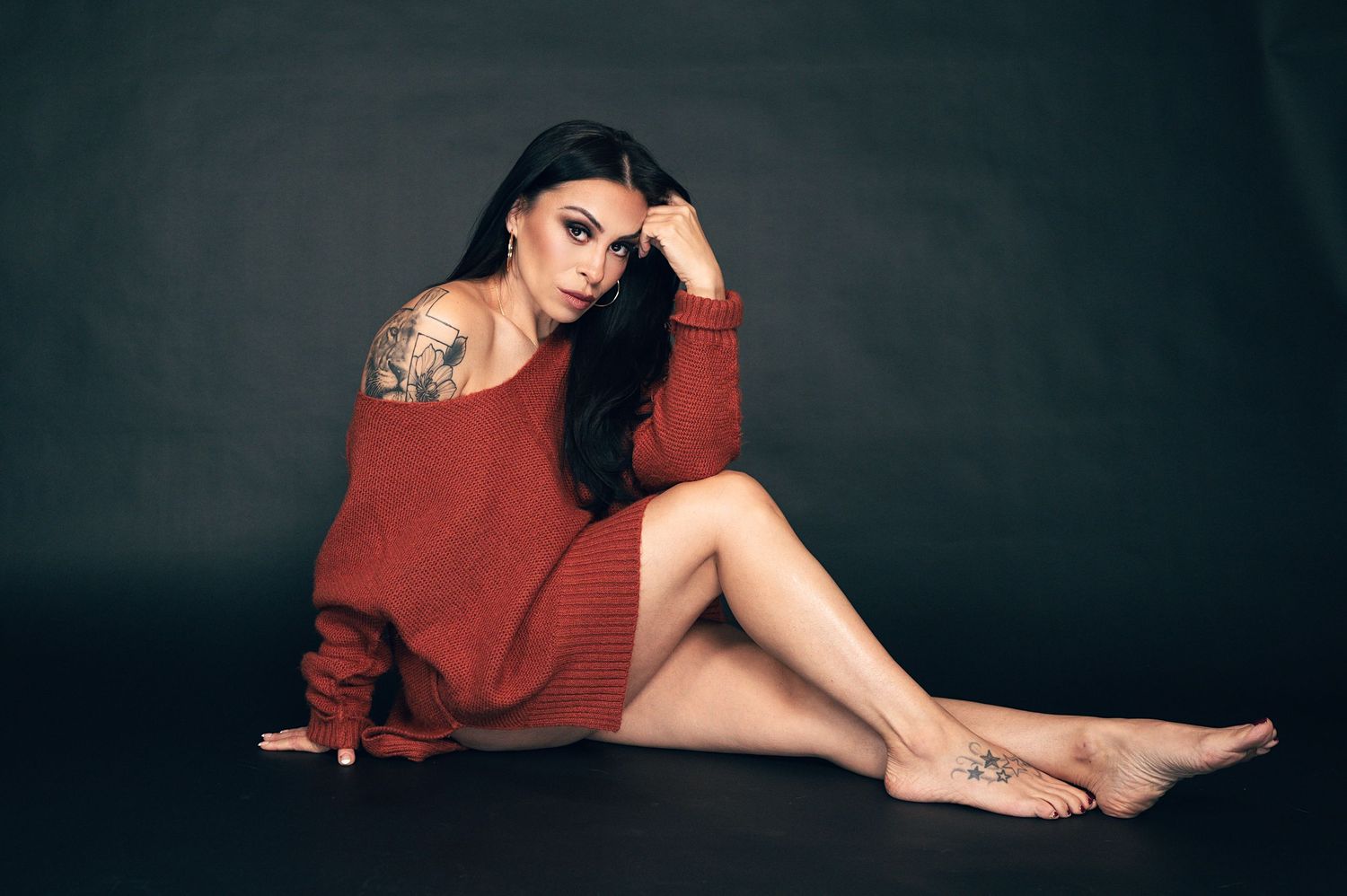 Woman in a cozy sweater posing for a 40 over 40 boudoir photoshoot in Utah, Creative portraits photographed by Carl James Photography.