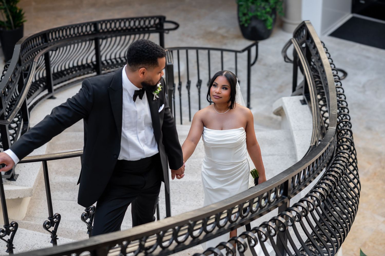 Palm Beach wedding photographers captured this bride and groom on a Palm Beach staircase.