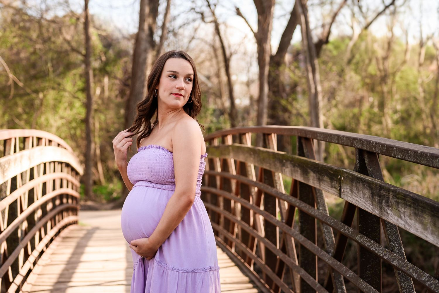 North Richland Hills Mom posing on bridge during maternity photoshoot