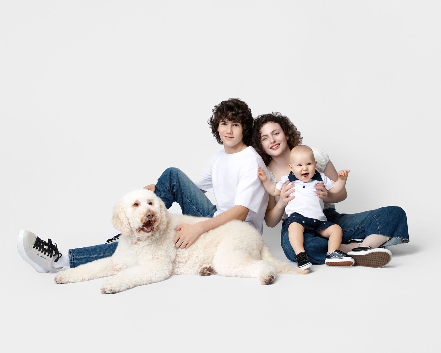 family studio portrait Sarasota white background parents with three kids and poodle clean modern timeless photography