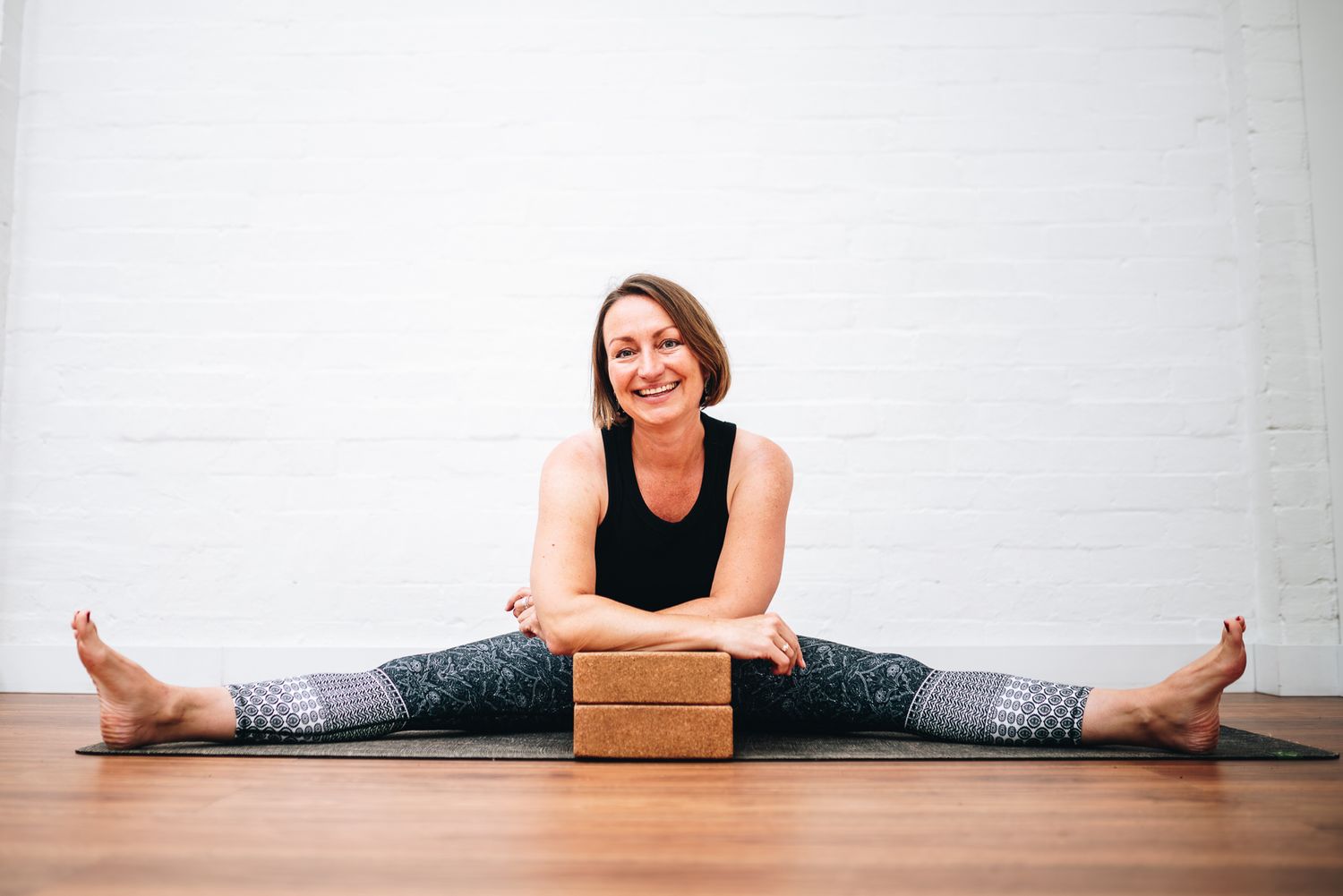 Yoga client having a relaxed stretching session for a professional business branding photography session with a Melbourne photographer