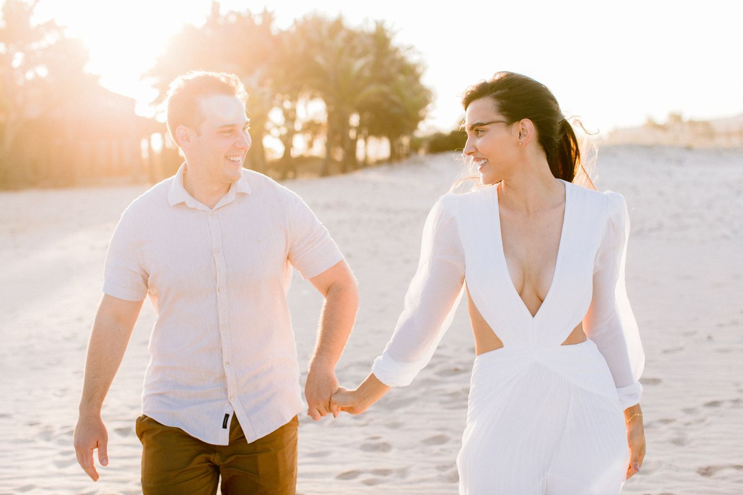 Romantic beach engagement session at sunset.