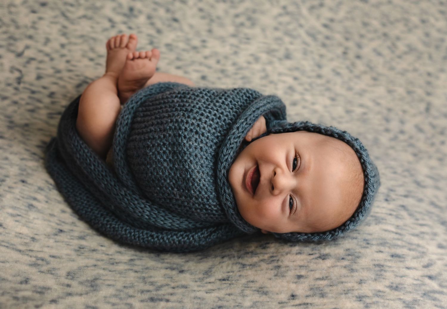 Charlottesville photographer, newborn, maternity, family, baby, baby boy smiling in blue wrap and hat