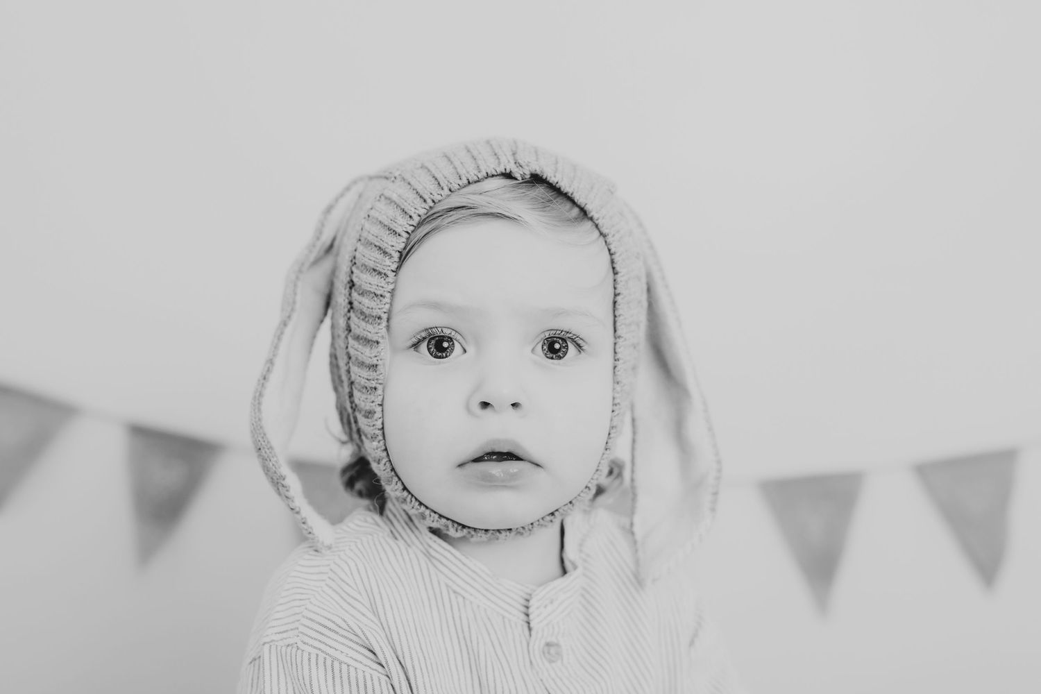 Black and white portrait of a baby wearing a ruffled bonnet. Photographer. Hull. East Yorkshire. Photography