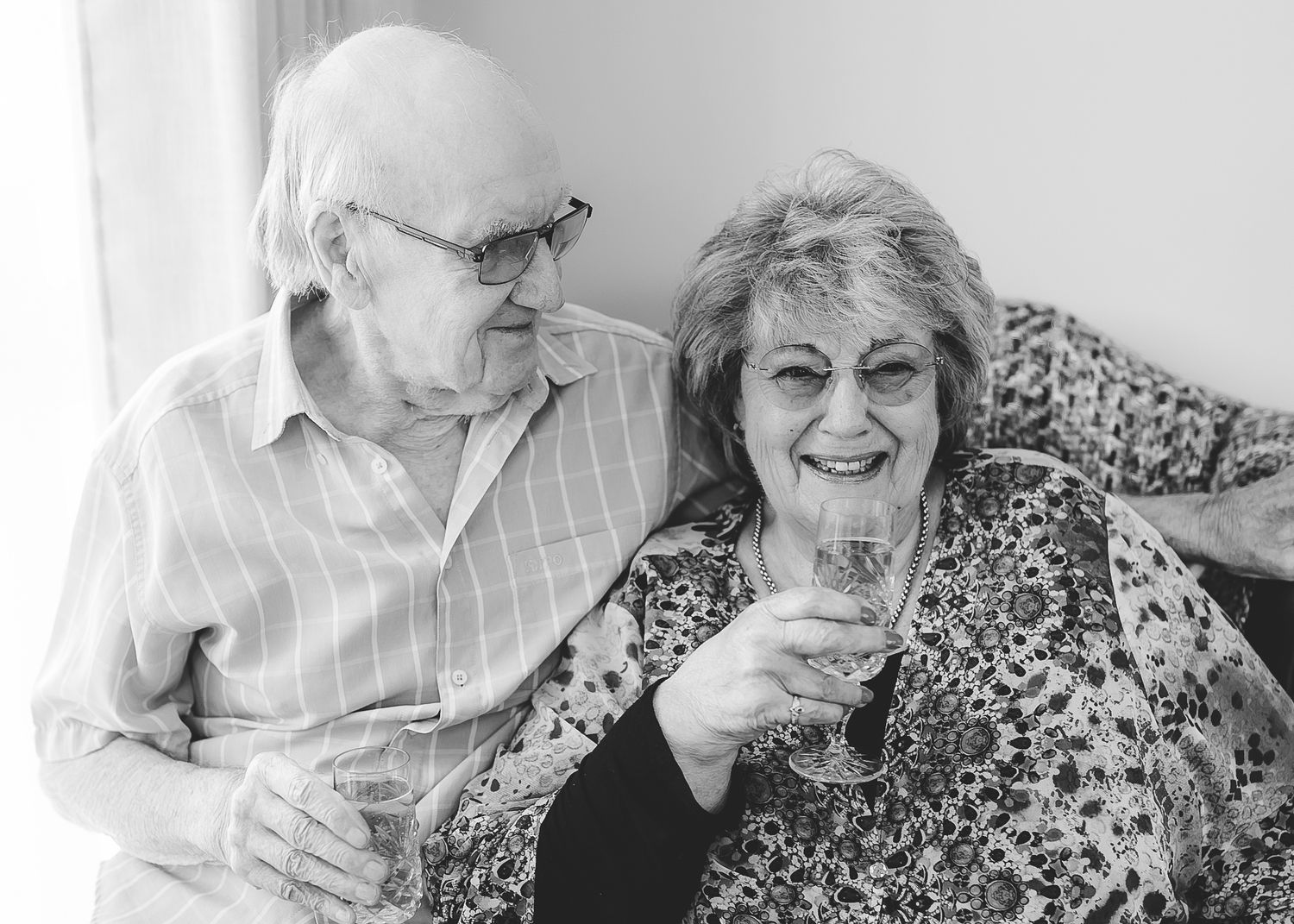 Series of candid moments showing elderly woman laughing and interacting with family. Photographer. Hull. East Yorkshire. Photography