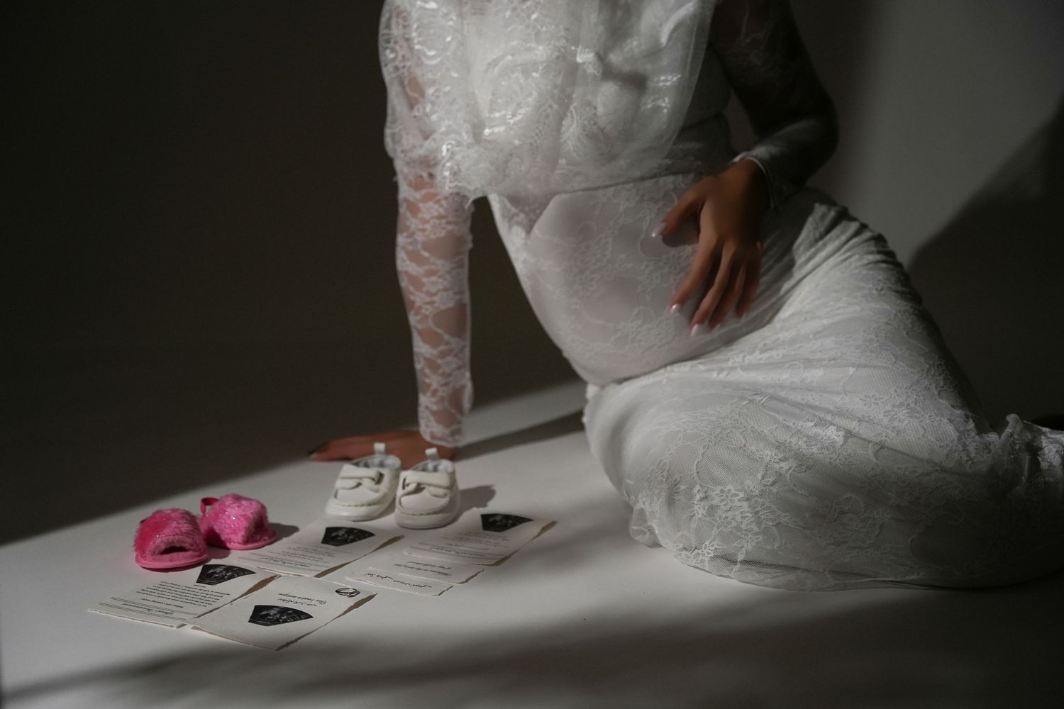 Pregnant woman in private studio with female Maternity Photographer In Dubai capturing elegant, modest maternity photoshoot moments