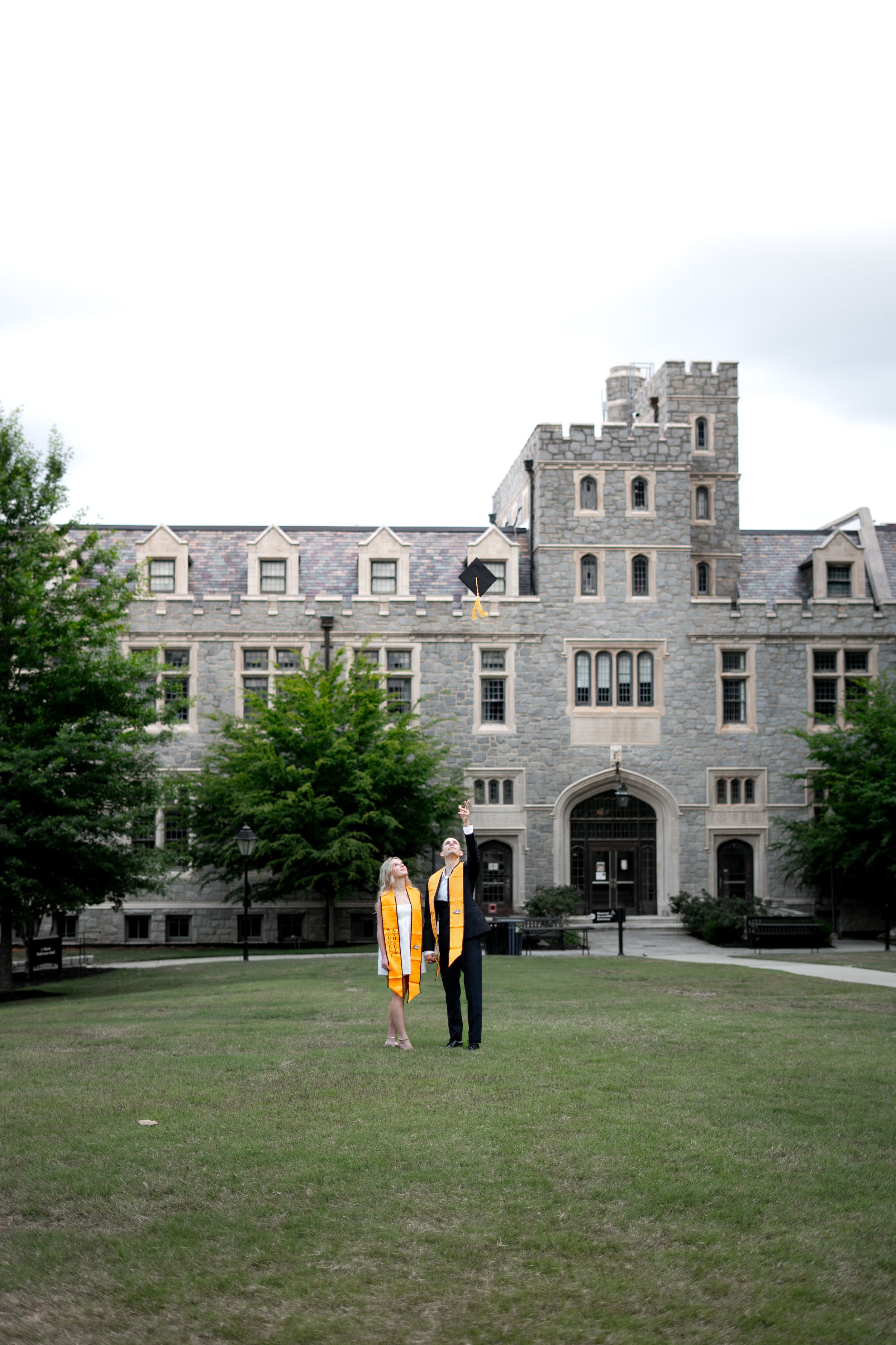 Oglethorpe graduation photos in front of oglethorpe Weltner library