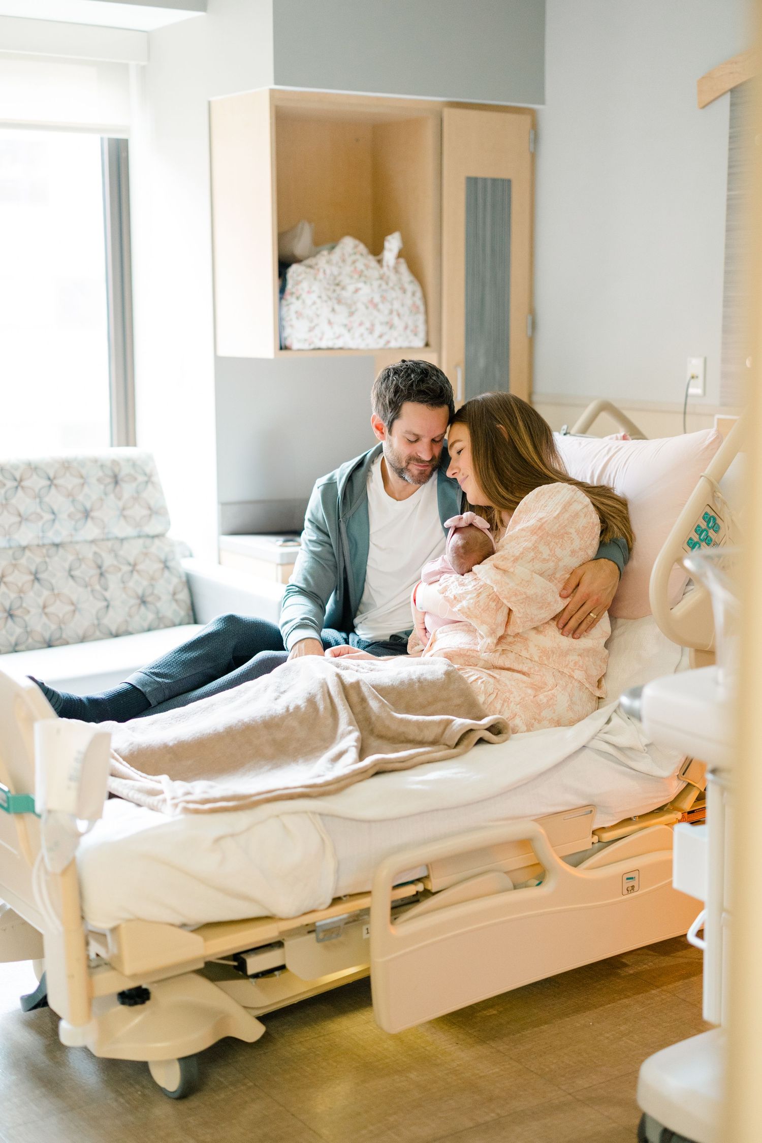A series of four connected images showing a hospital patient resting in a white hospital bed with a visitor nearby.