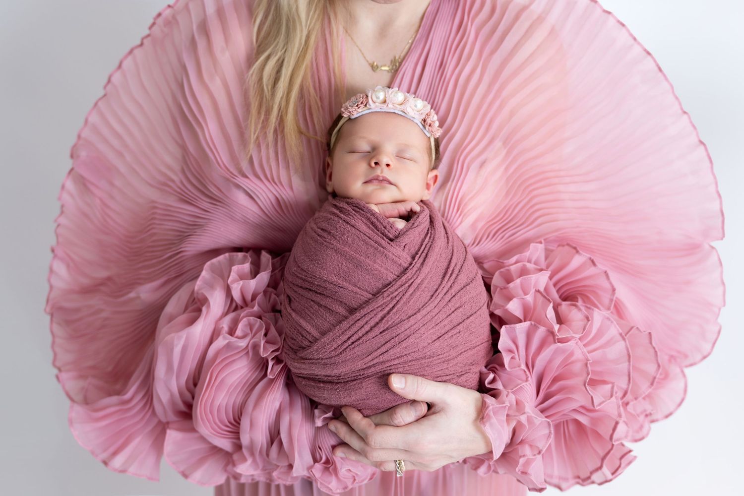 Soft-lit newborn portrait by a professional new born photographer Dubai
