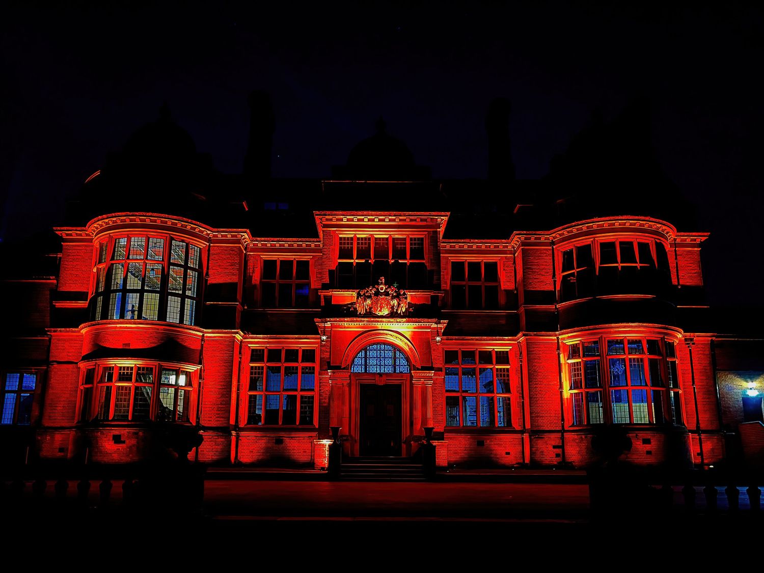 Melchet Court outside up lighting summer darkness, multi coloured, multi function lights
