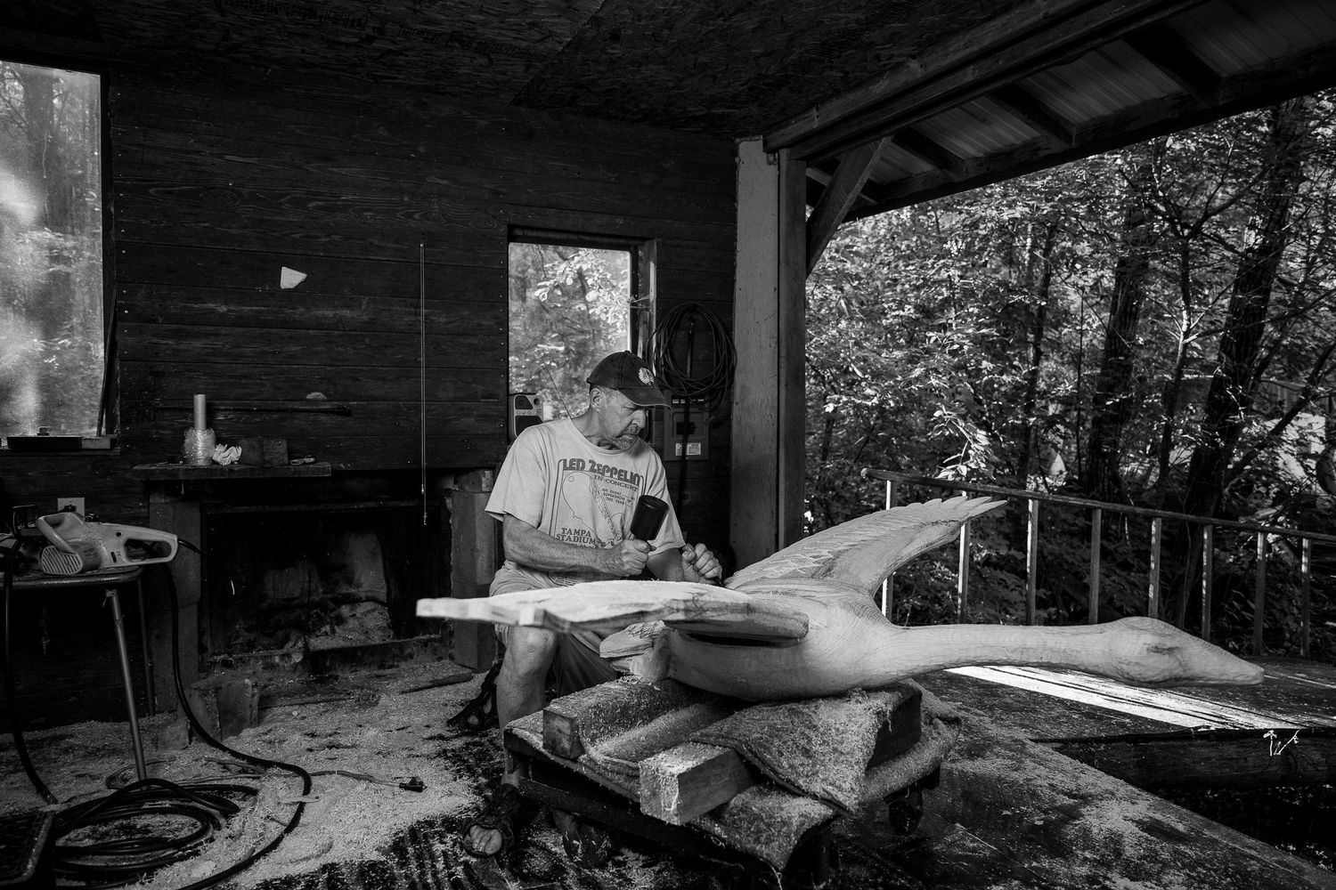 Black and white photographs show a cluttered workshop space with tools and equipment scattered throughout.