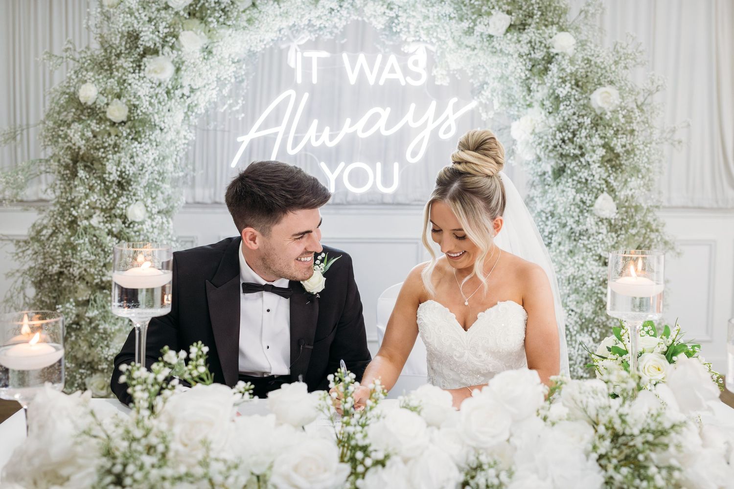 A newly wed couple sign the register after doing their vows, at the Park Hotel, Liverpool