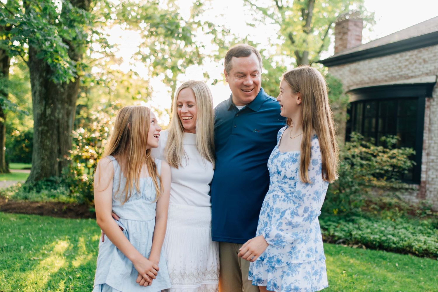Family laughing for photos at Succop Nature Park in Butler, PA