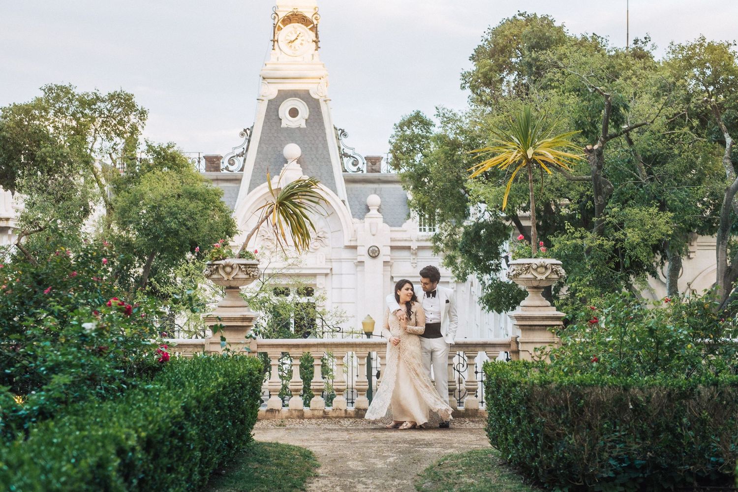 Romantic and sophisticated couple posing in the grand surroundings of Pestana Palace, Lisbon
