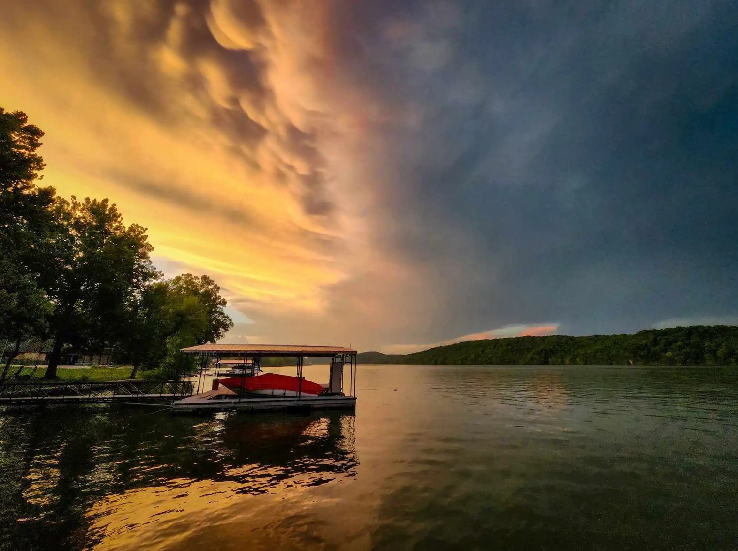 sunset during a storm at lake of the ozarks