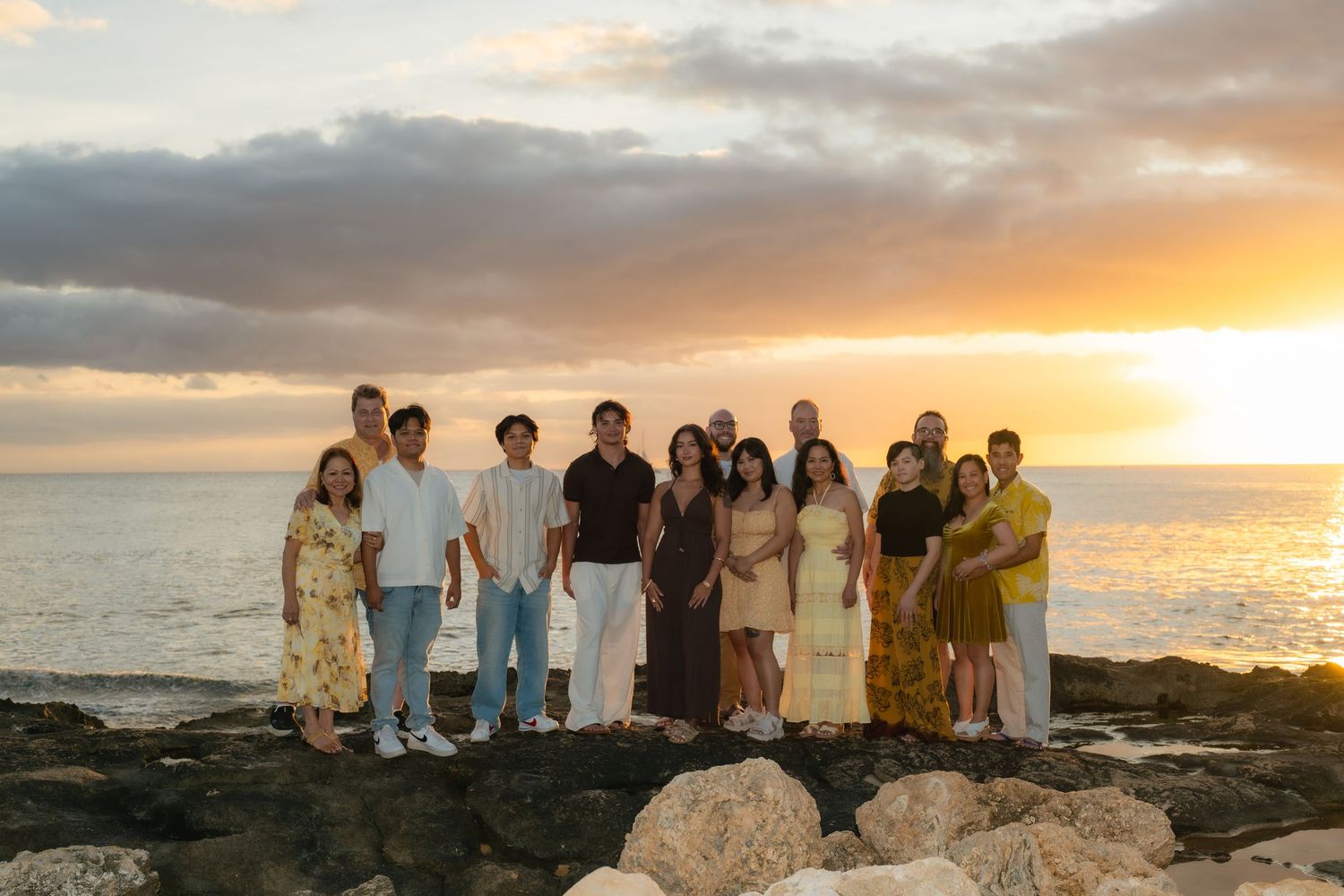 family on waikiki beach posing for a photo