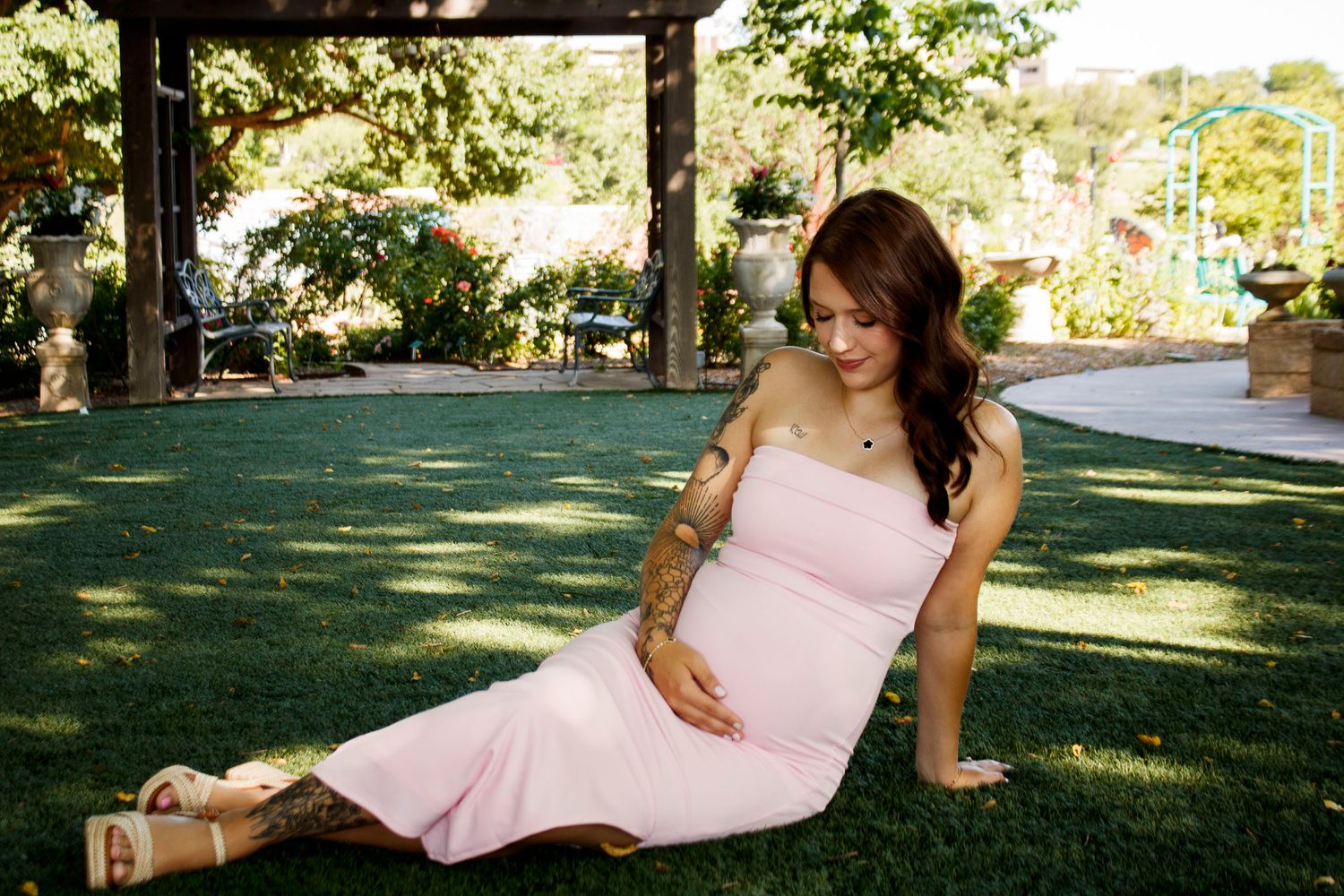 An expecting mother during a maternity photo session at the Botanical Gardens in Amarillo, Texas