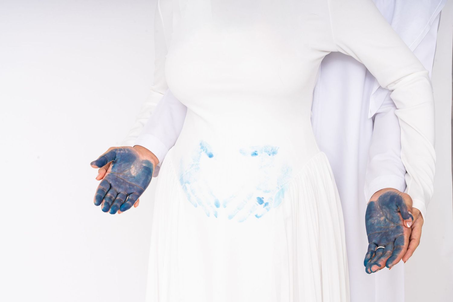 Modern maternity photoshoot Dubai with soft lighting and neutral tones inside a photography studio Dubai near Arjan.