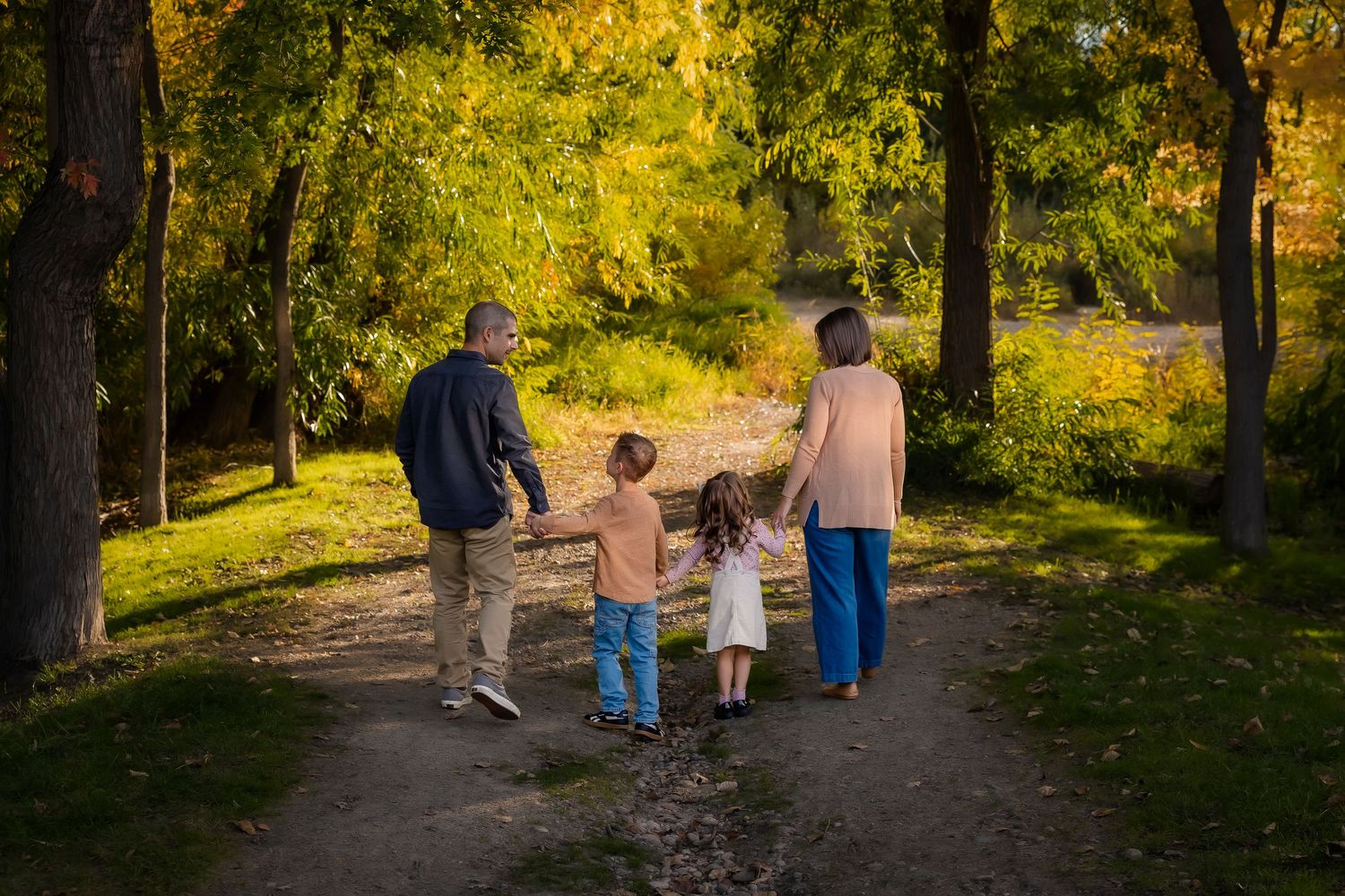 family of 4 walking on the greenbelt