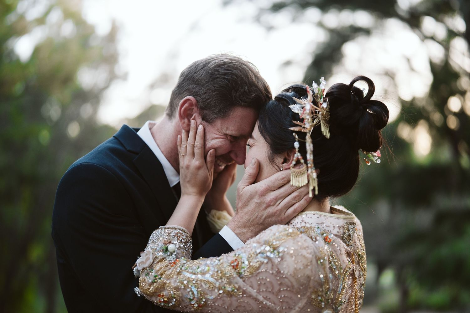 Cameron and Lulu forehead to forehead in golden light, Perth wedding photography