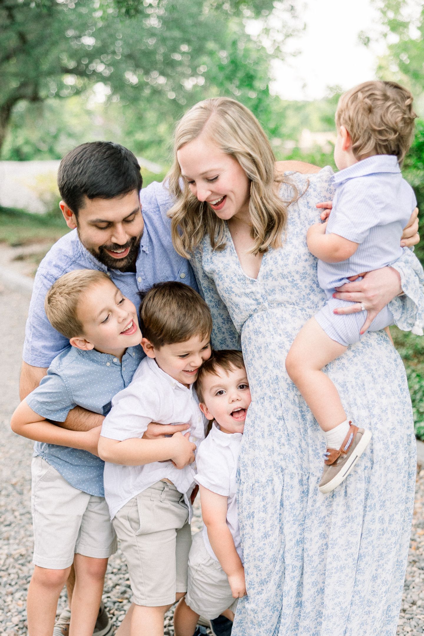 Augusta family photographer capturing candid moment with parents and four boys